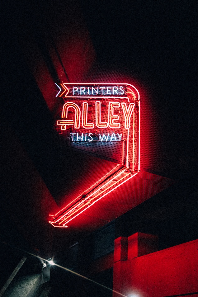 Vibrant Pink Neon Sign of Printer's Alley near Broadway in Nashville, Tennessee