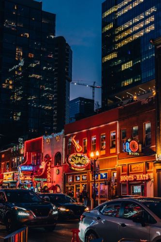 Glowing lights on a busy night on Broadway Street, in Downtown Nashville, Tennessee